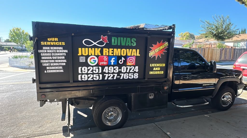 Divas Junk Removal Services black dump truck with service lettering parked in East Bay California